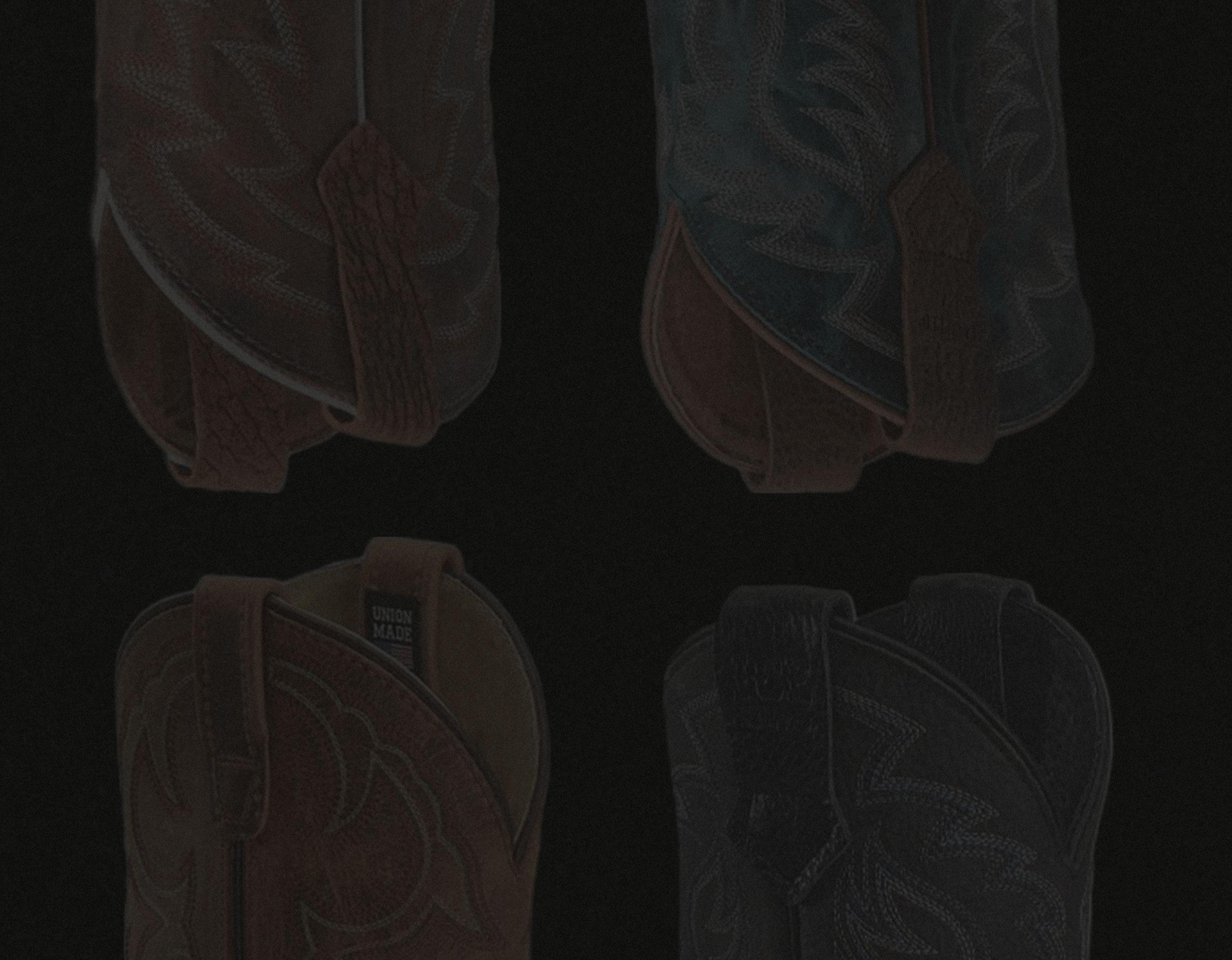 Four Double-H boots with different piping colors.