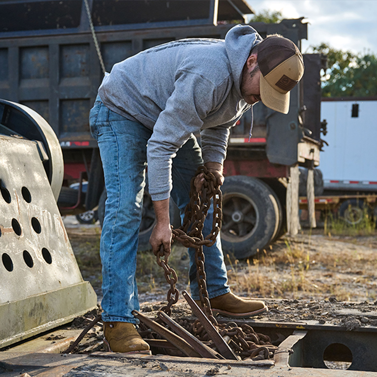 A man working on the job site wearing the Dwight Steel Toe in brown.