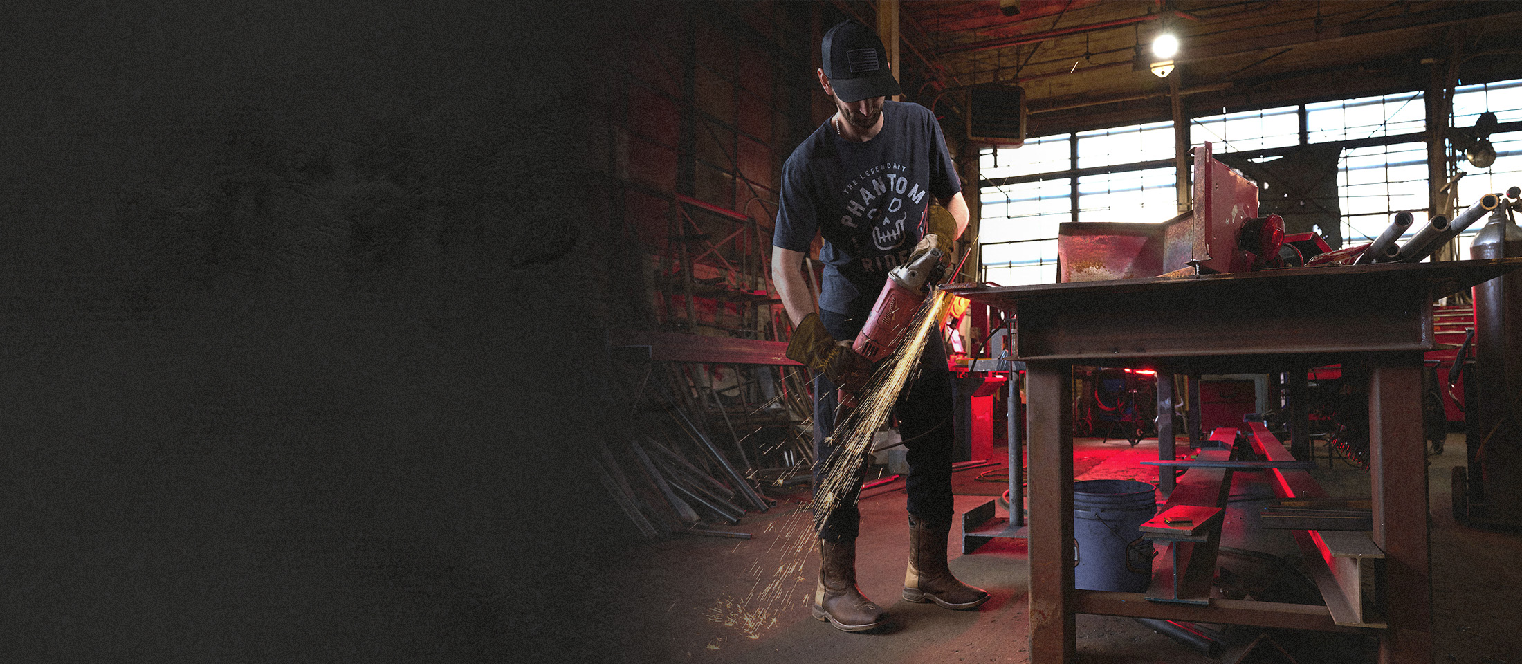 A welder wearing the malign western boot in brown.